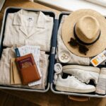Open carry-on suitcase flat-lay packed for 2 weeks in Europe