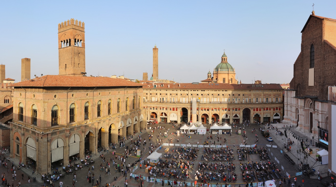 Expansive panoramic view of Piazza Maggiore in Bologna Italy showing historic medieval palazzi