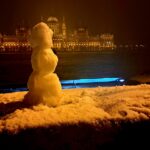 Hungarian Parliament Building illuminated along the Danube River in winter Budapest Hungary