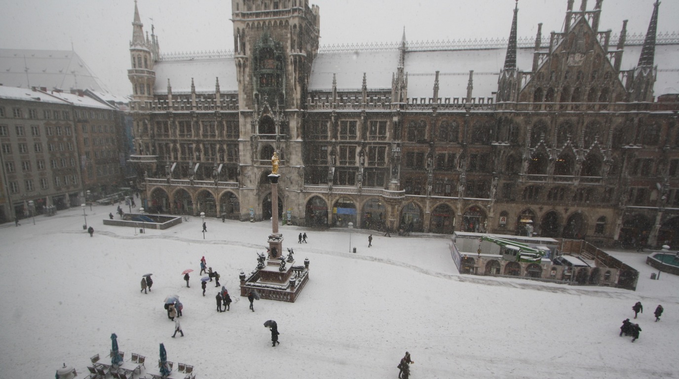 Snow covered Marienplatz and Gothic Neues Rathaus town hall in winter Munich Bavaria Germany
