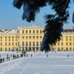 Schönbrunn Palace covered in winter snow in Vienna Austria